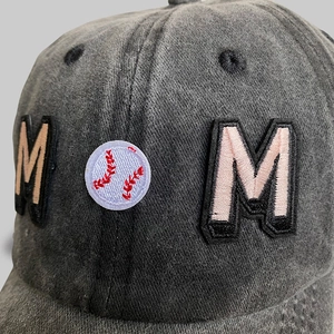 Washed charcoal denim baseball cap featuring Mom embroidery with baseball graphic detail