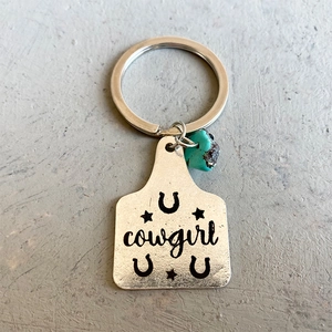 Western style silver cowgirl keychain with turquoise stone and horseshoe star engravings