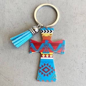 Western cowboy style leather keychain with tribal cross pendant and light blue tassel