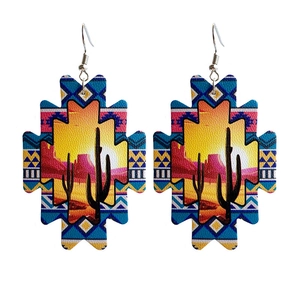 Aztec sunflower leather earrings with western cactus and desert sunset landscape
