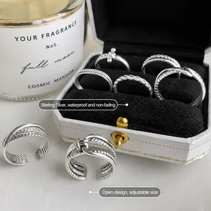 Set de anillos vintage de plata de ley 925 ajustables con diseños trenzados en caja