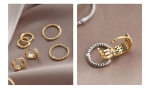 Detalle macro del sello S925 en pendientes de plata y earcuffs con pavé de circonitas