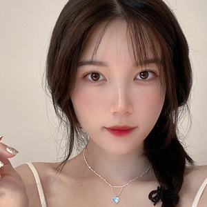 Double-layered S925 silver heart necklace with glowing moonstone on female model