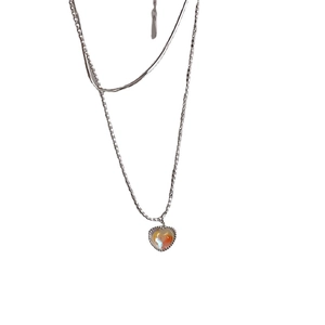 Silver-plated double-layer heart pendant necklace with shimmering orange stone inlay