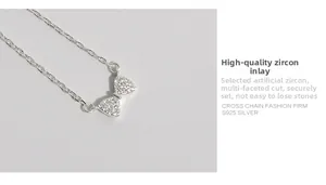 Détail macro du pendentif nœud en argent S925 serti de zircons cubiques scintillants