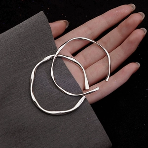 Silver-plated Mobius bangle set with irregular wave design and polished finish