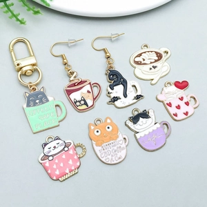 Detail view of colorful cat and coffee cup enamel alloy charms for DIY jewelry making