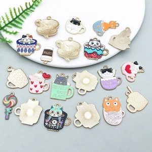 Detail of colorful enamel cat coffee cup charms and DIY alloy jewelry pendants