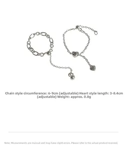 Detail of adjustable silver heart chain rings with pull-bead closure for a custom fit