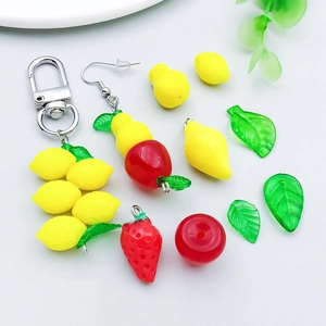 Macro detail of colorful acrylic fruit pendants for DIY jewelry making and accessories