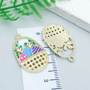 Close-up of Easter basket pendants with colorful enamel eggs and gold metal grid back