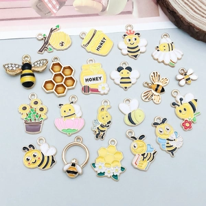 Sortiment an gelben Emaille Bienen und Honigglas Anhängern für DIY Schmuckherstellung