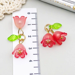 Detail of lily of the valley earrings in pink resin with ruler showing 3.5cm size