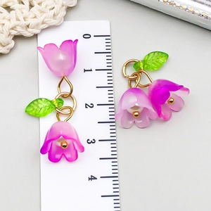 Detailed view of lily of the valley acrylic flower pendant with pearl and ruler measurement