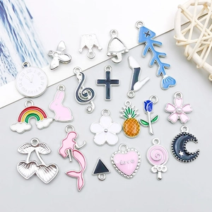 Macro shot of assorted colorful enamel rabbit and cherry charms for DIY jewelry making