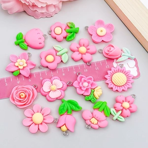 Pink resin flower and strawberry charms for DIY jewelry with metal rings and size scale