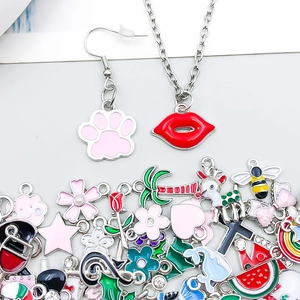 Detailed close-up of mixed enamel alloy charms in various animal and flower shapes