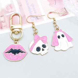 Pink enamel Halloween charm set with skeleton and ghost details on gold alloy base