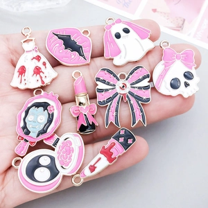 Pink gothic Halloween enamel charms set featuring skulls and daggers for DIY jewelry