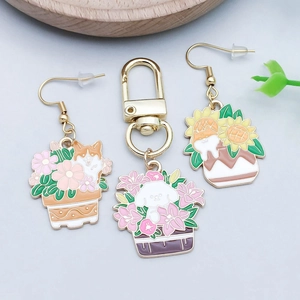 Close-up of enamel puppy and flower charms for earrings and keychains jewelry making