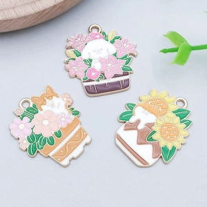 Detail of colorful enamel puppy and kitten in flower pot charms for DIY jewelry making