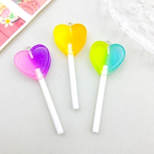 Three glittery heart lollipop resin pendants in gradient colors for DIY jewelry making
