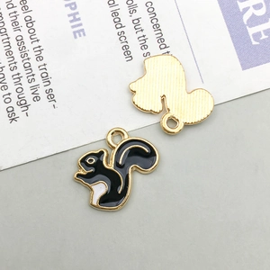 Front and back view of squirrel charms with enamel finish and gold plated back details