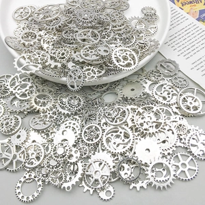 Close-up of mixed silver alloy steampunk gears and mechanical charms for DIY crafting