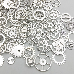 Macro shot of assorted steampunk alloy mechanical gear charms in bright silver finish