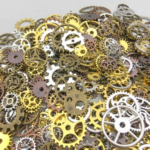 Close-up of mixed steampunk alloy gears in various metallic finishes for DIY jewelry crafts