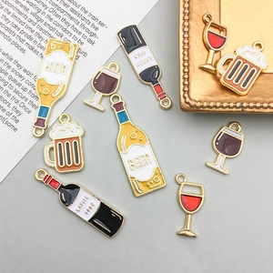 Detailed view of DIY cartoon wine bottle and beer mug charms for creative jewelry making