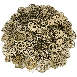 Mixed set of vintage steampunk alloy gears and mechanical pendants on white background