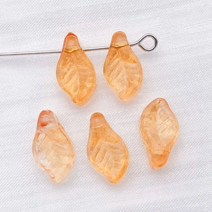 Five orange glass leaf beads with engraved veins for DIY jewelry making