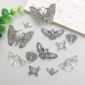 Vintage hollow butterfly and moth metal pendants for DIY jewelry making in silver