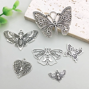 Set of retro silver butterfly pendants with hollow design and antique finish for DIY jewelry