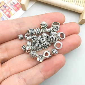 Antique silver alloy spacer beads and charms set with floral and geometric patterns