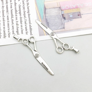 Detailed view of vintage silver alloy scissors pendant with Smooth engraving for DIY jewelry