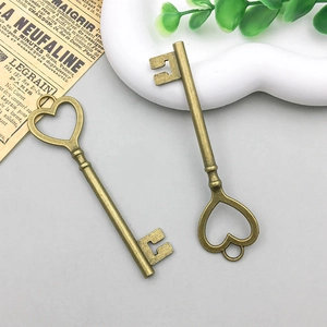 Detailed close-up of vintage bronze alloy heart key pendants for DIY jewelry making