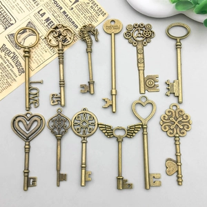 Detailed collection of 11 vintage bronze alloy charms featuring heart and wing designs