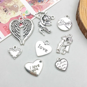 Detailed set of 8 antique silver heart and wing charms for DIY jewelry making