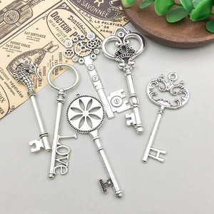 Set of six vintage silver alloy key pendants with diverse shapes for DIY jewelry making