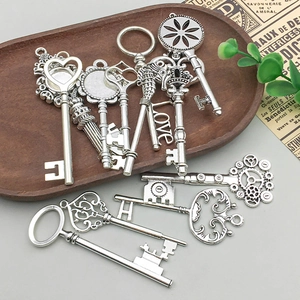 Macro view of assorted antique silver alloy key charms for DIY jewelry crafting