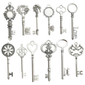 Set of 12 vintage antique silver alloy key pendants with diverse artistic carvings