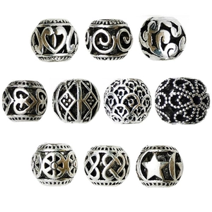 Set of 10 vintage silver alloy hollow flower beads with diverse antique relief patterns