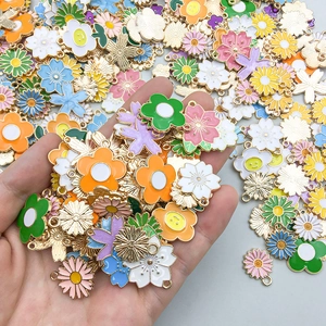 Assorted colorful enamel flower pendants in golden alloy for DIY jewelry making