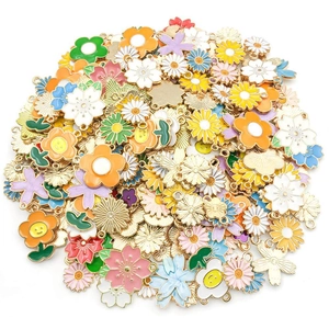 Assorted colorful enamel flower pendants in sunflower and daisy styles for DIY jewelry
