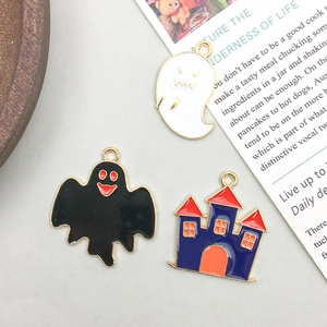 Detail of Halloween enamel charms featuring ghost and castle with gold plating finish