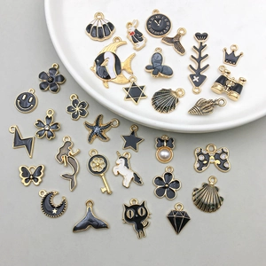 Black and white alloy charms in mixed styles featuring ocean, animal and floral themes