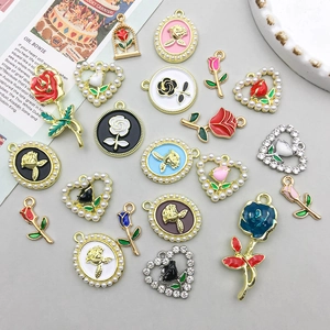 Detail of colorful enamel rose pendants with imitation pearls and rhinestones for DIY jewelry