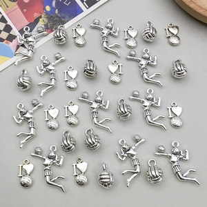 Detailed view of antique silver volleyball charms for DIY jewelry making sets